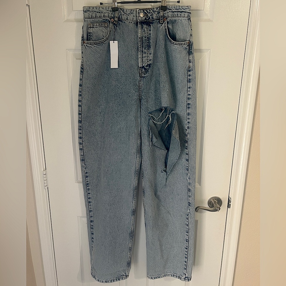 Topshop Oversized mom jeans with rip in bleach